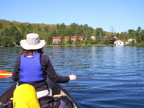 Jen, a former city girl, paddling a canoe