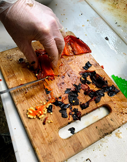 Removing skin and seeds from roasted red peppers