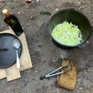 Prepping a Dutch oven meal at camp